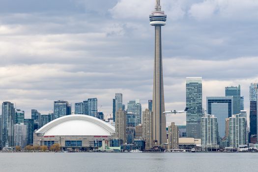 Toronto skyline with CN Tower, modern skyscrapers, and waterfront view.
